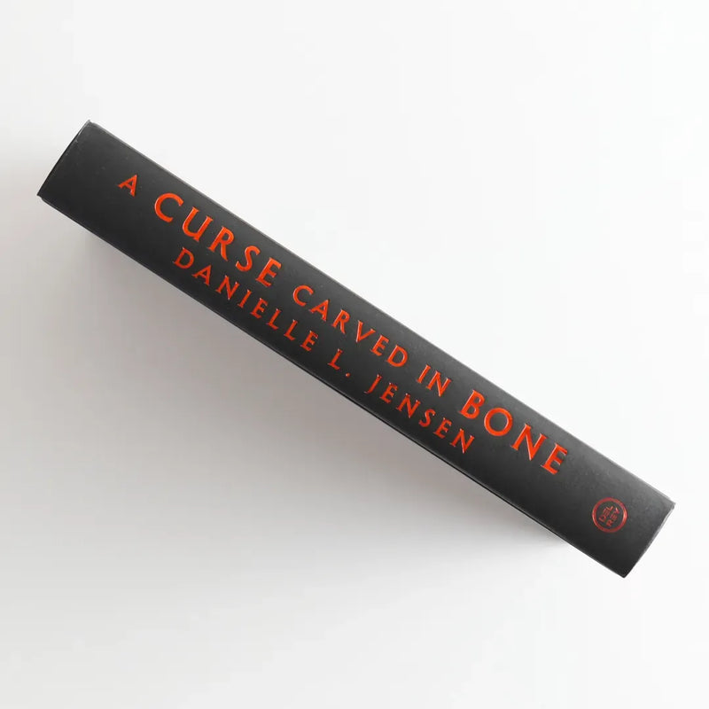 A Curse Carved in Bone US - Hardback