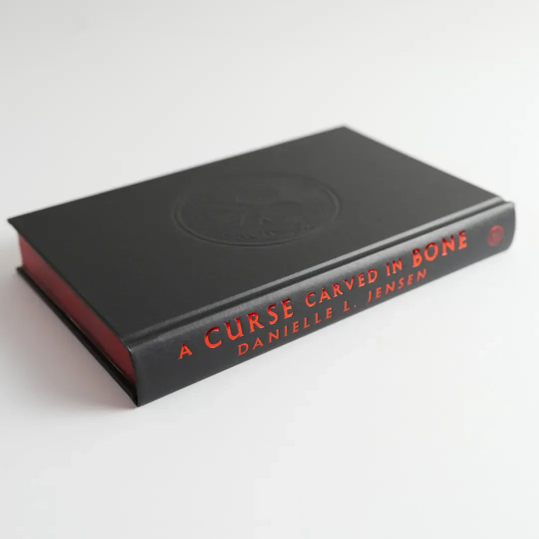 A Curse Carved in Bone US - Hardback