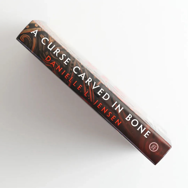 A Curse Carved in Bone US - Hardback